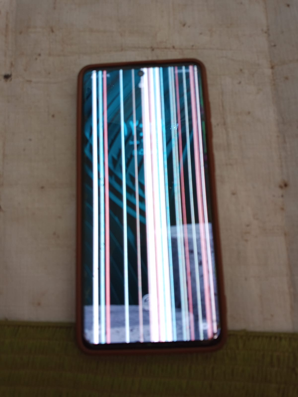 Phone with a damaged, striped screen
